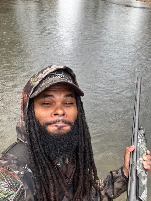 Joel Cedric Oliver II hunting in the woods for Heaven Sake Outdoors.